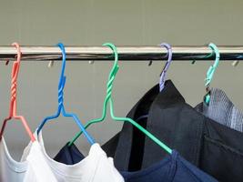 Colorful plastic hanger with the shirt. photo