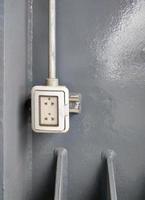 The electrical outlet with the clear cover to prevent splashing water. photo