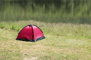 Red tent near the small reservoir. photo