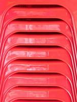 Closeup of the plastic chair stack. photo