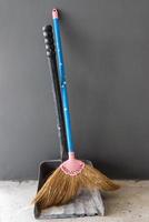 Old broom and dustpan photo