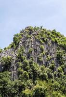 High limestone mountain with small cave. photo