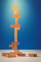 tower of wooden blocks on a blue background photo