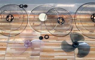 Many parts of the table fan are ventilated at the side of the house after the cleaning. photo