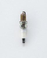 Old spark plug on the whtie canvas background. photo