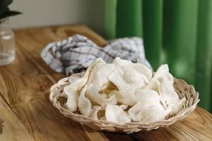 Krupuk Upil or Krupuk Mlarat, Indonesian Popular Cracker made from Cassava Flour and Fried without Oil. photo