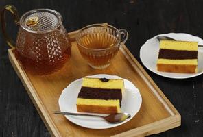 Spiku Lapis Surabaya, Three Layer Cake Vanilla with Chocolate in the Middle. Every Layer with Jam. Usually Served with Tea photo