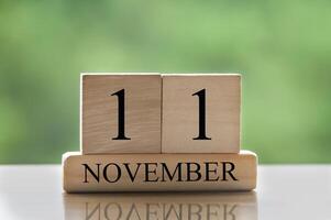 November 11 calendar date text on wooden blocks with copy space for ideas or text. Copy space photo