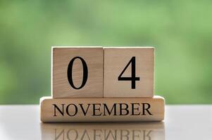 November 4 calendar date text on wooden blocks with copy space for ideas or text. Copy space photo