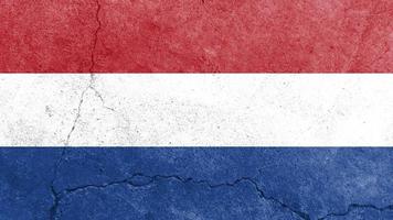 Netherlands flag. Netherlands flag on cracked cement wall photo