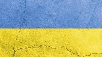 Ukraine flag. Ukraine flag on cracked cement wall photo