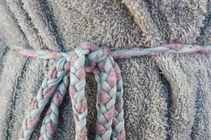 Detailed close up view on samples of cloth and fabrics in different colors found at a fabrics market photo