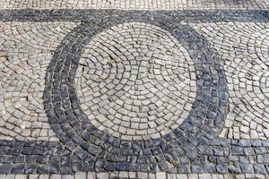 Detailed close up on old historical cobblestone roads and walkways photo