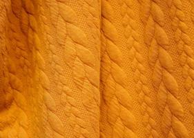 Detailed close up view on samples of cloth and fabrics in different colors found at a fabrics market photo