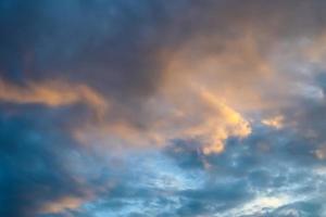 Beautiful panorama of orange and yellow clouds at sunrise photo