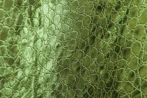 Detailed close up view on samples of cloth and fabrics in different colors found at a fabrics market photo