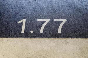 Numbers painted on concrete and asphalt surfaces photo