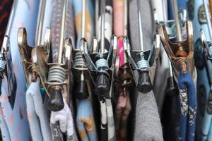 Detailed close up view on samples of cloth and fabrics in different colors found at a fabrics market photo