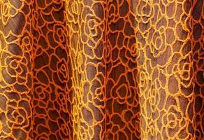 Detailed close up view on samples of cloth and fabrics in different colors found at a fabrics market photo