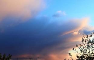 Beautiful panorama of orange and yellow clouds at sunrise photo