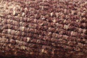 Detailed close up view on samples of cloth and fabrics in different colors found at a fabrics market photo