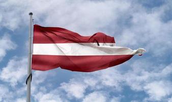 Latvia flag - realistic waving fabric flag. photo