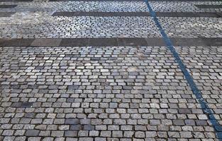 Detailed close up on old historical cobblestone roads and walkways photo