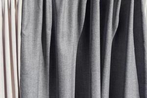 Detailed close up view on samples of cloth and fabrics in different colors found at a fabrics market photo