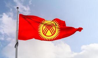 Kyrgyzstan flag - realistic waving fabric flag. photo