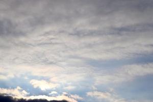 Beautiful panorama of orange and yellow clouds at sunrise photo