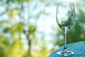 Empty wine glass on the table photo