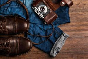 Jeans, boots and photo camera