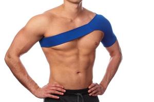 Man with a support bandage on his shoulder photo