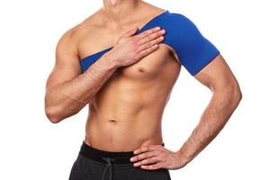 Man with a support bandage on his shoulder photo