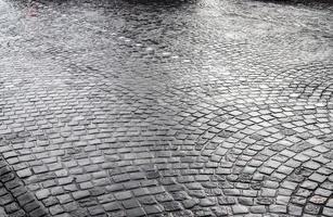 Detailed close up on old historical cobblestone roads and walkways photo