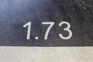 Numbers painted on concrete and asphalt surfaces photo