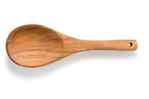 Empty wooden spoon isolated on white photo