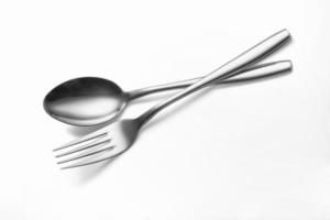 Spoon, and fork on a white background photo