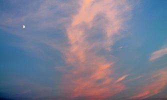 Beautiful panorama of orange and yellow clouds at sunrise photo