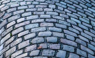 Detailed close up on old historical cobblestone roads and walkways photo