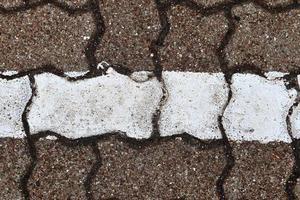 Detailed close up on old historical cobblestone roads and walkways photo