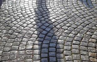 Detailed close up on old historical cobblestone roads and walkways photo