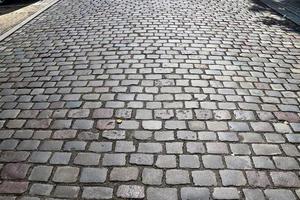 Detailed close up on old historical cobblestone roads and walkways photo