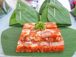 Pork curry jelly is placed on banana leaf photo