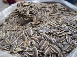 Pile of sunflower seeds roasted for sale in the market photo