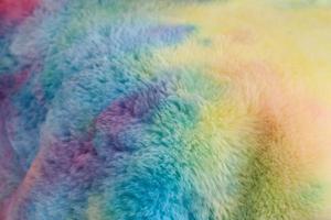 Detailed close up view on samples of cloth and fabrics in different colors found at a fabrics market photo