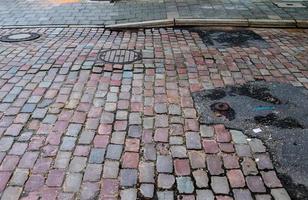 Detailed close up on old historical cobblestone roads and walkways photo