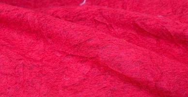 Close up view on samples of cloth and fabrics in different colors found at a fabrics market photo