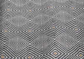 Detailed close up view on samples of cloth and fabrics in different colors found at a fabrics market photo