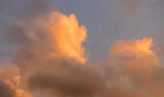 Beautiful panorama of orange and yellow clouds at sunrise photo